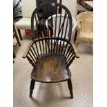 A LARGE EARLY ELM WINDSOR STICK BACK CHAIR BEARING A CROWN STAMP AND THE INITIALS JS