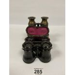 A PAIR OF VICTORIAN BRASS AND LEATHER BOUND BINOCULARS, TOGETHER WITH TWO PAIRS OF OPERA GLASSES,