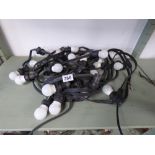 AN EXTERIOR RUN OF LIGHTING 24 SOCKETS AND BULBS, ONE BULB MISSING