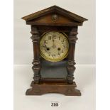 A VICTORIAN OAK CASED MANTLE CLOCK, THE SILVERED DIAL WITH ARABIC NUMERALS DENOTING HOURS, 34CM HIGH