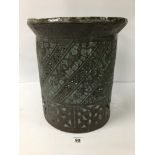 A LARGE BRONZED METAL VESSLE OF CYLINDRICAL FORM WITH PIERCED AND ENGRAVED DETAILING THROUGHOUT,