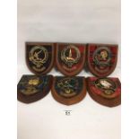 SIX SCOTTISH CLAN CREST SHIELDS, MOUNTED UPON WOODEN BACK, APPROX 20CM LONG
