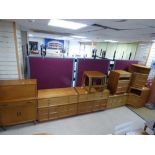 A MID CENTURY RANGE OF TEAK FURNITUE BY NATHAN INCLUDING SEVERAL CUPBOARDS, A NEST OF TABLES AND A