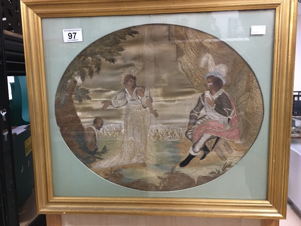 A REGENCY PERIOD SILKWORK PICTURE OF OVAL FORM, DEPICTING FIGURES IN LANDSCAPE, FRAMED AND GLAZED,