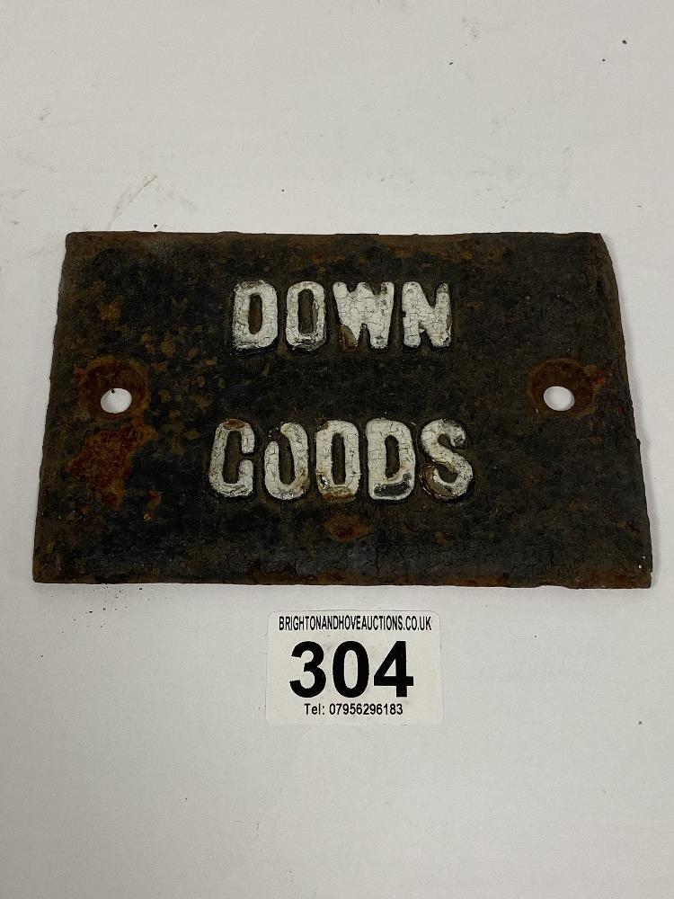 A CAST IRON "DOWN GOODS" RAILWAY SIGN, 14CM BY 9.5CM