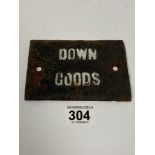 A CAST IRON "DOWN GOODS" RAILWAY SIGN, 14CM BY 9.5CM