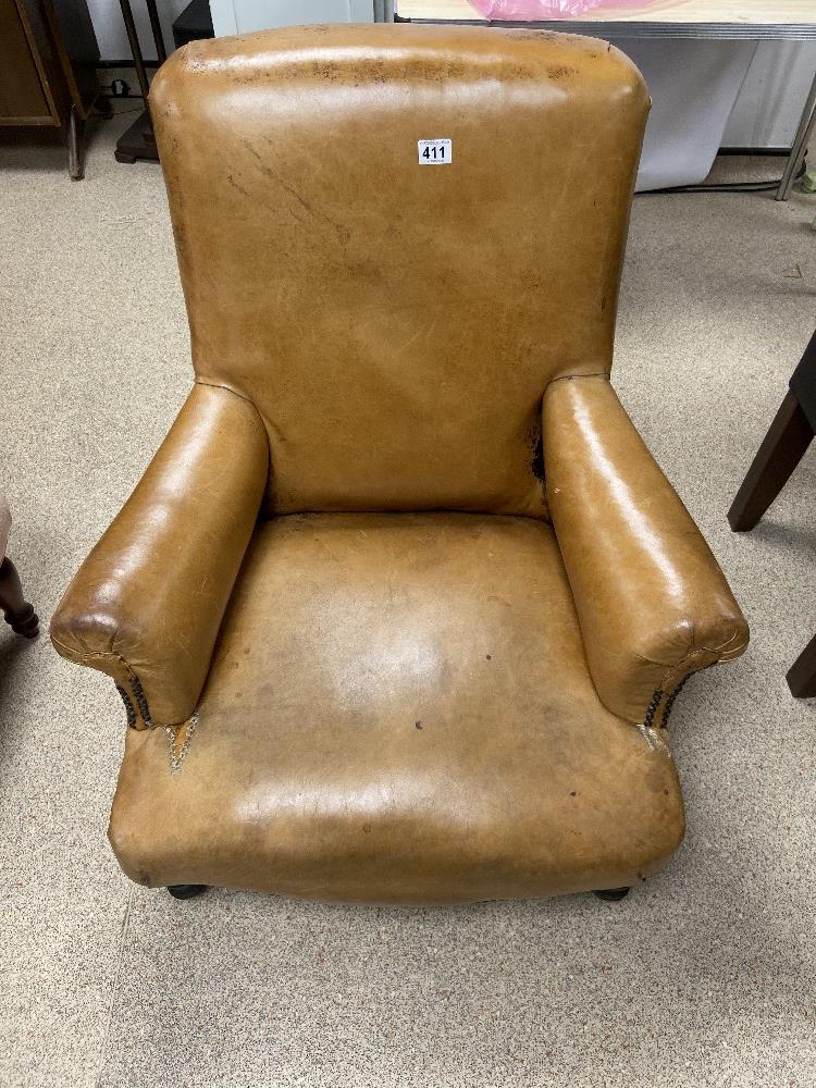 A VINTAGE BROWN LEATHER CLUB ARMCHAIR