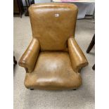 A VINTAGE BROWN LEATHER CLUB ARMCHAIR