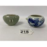 TWO EARLY CHINESE PORCELAIN BIRD FEEDER, ONE WITH BLUE AND WHITE PAINTED SCENE DEPICTING A DRAGON