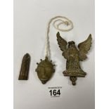 A BRASS DOOR KNOCKER IN THE FORM OF AN EAGLE, TOGETHER WITH A BRASS MASK AND A SMALL ICON