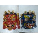 TWO WOODEN QROTESQUE MASKS 32 X 32 CMS