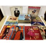 AN ASSORTMENT OF VINTAGE VINYL RECORDS/ALBUMS, INCLUDING ELVIS, THE BEACH BOYS AND MORE