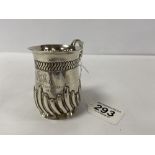 A VICTORIAN SILVER CHRISTENING MUG WITH EMBOSSED DETAILING THROUGHOUT, LONDON 1886 BY JOSIAH