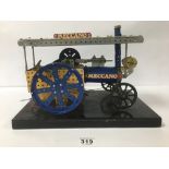 A MID CENTURY MECCANO SHOP DISPLAY OF A STEAM ENGINE WITH STEERING MECHANISM AND 240V MOTOR, 38CM