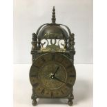 A VINTAGE BRASS BELL CLOCK, THE DIAL WITH ROMAN NUMERALS DENOTING HOURS, CONVERTED TO QUARTZ, 25CM