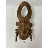 A CARVED WOODEN AFRICAN TRIBAL WALL MASK, 50CM HIGH