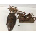 THREE CARVED WOODEN FIGURES, INCLUDING FARMER RIDING BULL AND CART, ANOTHER CART AND AN ORIENTAL
