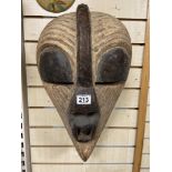 AN UNUSUALLY LARGE CARVED WOODEN AFRICAN TRIBAL MASK FROM THE CONGO SENAYE ZAIRE TRIBE,