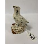 AN EARLY 19TH CENTURY STAFFORD SHIRE POTTERY BIRD WHISTLE DECORATED WITH A SPLASH GLAZE, 12.5CM