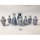 A COLLECTION OF EIGHT ORIENTAL BLUE AND WHITE PORCELAIN SPILL VASES, ONE WITH CHARACTER MARK TO