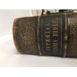 A LARGE LEATHER BOUND IMPERIAL FAMILY BIBLE CONTAINING THE OLD AND NEW TESTAMENT, PUBLISHED BY
