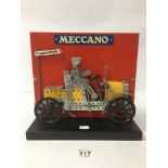 A MID CENTURY MECCANO SHOP DISPLAY SHOWING AN OF ERA MODEL CAR WITH DRIVER UNDER A MECCANO SIGN