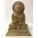 A SOAPSTONE FIGURE OF BUDDHA IN A SEATED POSITION, 28CM HIGH