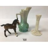 A BELLEEK PORCELAIN CANDLESTICK, 17.5CM HIGH, TOGETHER WITH A BESWICK HORSE AND A CERAMIC POURING