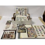 A COLLECTION OF STAMPS RANGING FROM EARLY GB THROUGH TO THE MODERN DAY IN ALBUMS