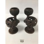 TWO PAIRS OF AFRICAN CARVED WOODEN CANDLESTICK HOLDERS, LARGEST 18.5CM HIGH