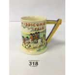 A WIDDICOMBE FAIR MUSICAL CERAMIC TANKARD, 11.5CM HIGH