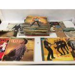 A COLLECTION OF VINTAGE VINYL RECORDS/ALBUMS, INCLUDING ELVIS, BUDDY HOLLY AND MORE