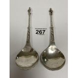 A PAIR OF CONTINENTAL WHITE METAL LADLES WITH APOSTLE TERMINALS, 104G