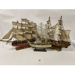 THREE CARVED WOODEN MODELS OF BOATS ON BASES, LARGEST 52CM WIDE
