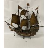 A LARGE CARVED WOODEN MODEL OF A GALLEON THREE MASTED SHIP, 62CM HIGH