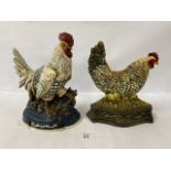 TWO FRENCH HEAVY METAL COCKEREL SHAPED DOOR STOPS WITH PAINTED DETAILING THROUGHOUT, LARGEST 31CM