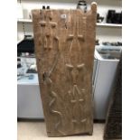 AN AUTHENTIC AFRICAN VINTAGE CARVED DOGON GRAIN STORE DOOR WITH METAL HANDLES, 134CM TALL BY 53CM