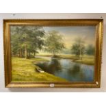 A LARGE FRAMED OIL ON CANVAS OF A BOAT BESIDE A LAKE AND WOODLAND SIGNED STANLEY