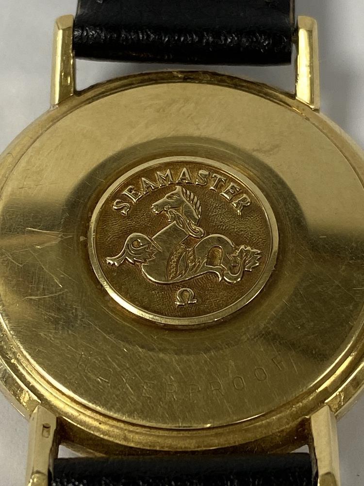 A VINTAGE GOLD CASED OMEGA SEAMASTER GENTS WRISTWATCH, THE SILVERED DIAL WITH BATONS DENOTING HOURS, - Image 3 of 3
