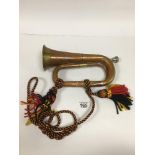 A COPPER AND BRASS BUGLE BY BOOSEY & HAWKES, 30CM LONG