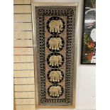 A FRAMED INTRICATE ASIAN EMBROIDERY WITH RAISED ELEPHANT DETAIL