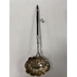 A GEORGE II SILVER PUNCH/TODDY LADLE WITH WHALEBONE HANDLE, 37CM LONG