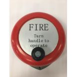 A FIRE BELL "TURN HANDLE TO OPERATE" 25CM DIAMETER