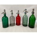 A GROUP OF FIVE FRENCH GLASS SODA SYPHONS, INCLUDING RED, GREEN AND CLEAR EXAMPLES, 31CM HIGH