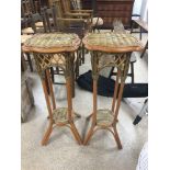A PAIR OF BAMBOO AND CANE PLANT STANDS 85CMS.