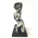 A MODERNIST METAL SCULPTURE OF A NUDE LADY RAISED UPON WOODEN BASE, STAMPED MK, 21CM HIGH