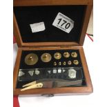 A BOXED SET OF VINTAGE BRASS WEIGHTS, RANGING FROM 10MG TO 100G