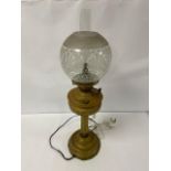 A BRASS DUPLEX OIL LAMP OF COLUMN FORM, PREVIOUSLY CONVERTED TO MAINS, WITH ORIGINAL GLASS SHADE AND