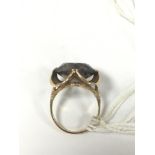 A 9CT GOLD RING SET WITH A LARGE SMOKEY QUARTZ, RING SIZE N/O, 6.3G