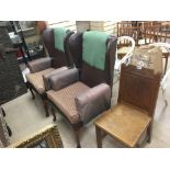 A PAIR OF WING BACK CHAIRS WITH AN OAK CHAIR DATED 1954.